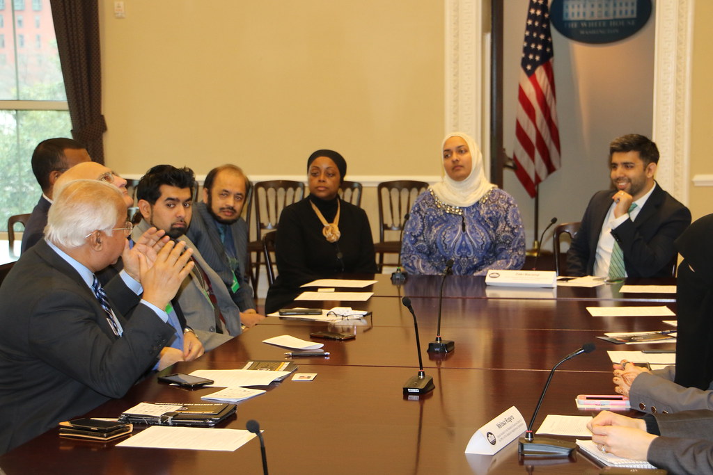 A diverse group participating in a civic roundtable discussion